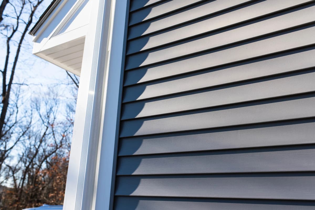 Close-up of dark lap siding on a home in Wyoming, MN