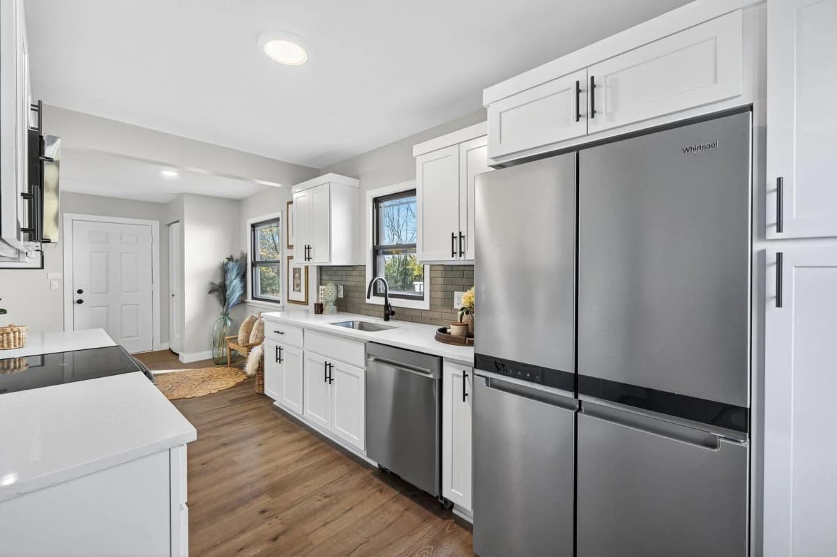 White kitchen cabinets and stainless steel appliances in a Hugo, MN kitchen remodel